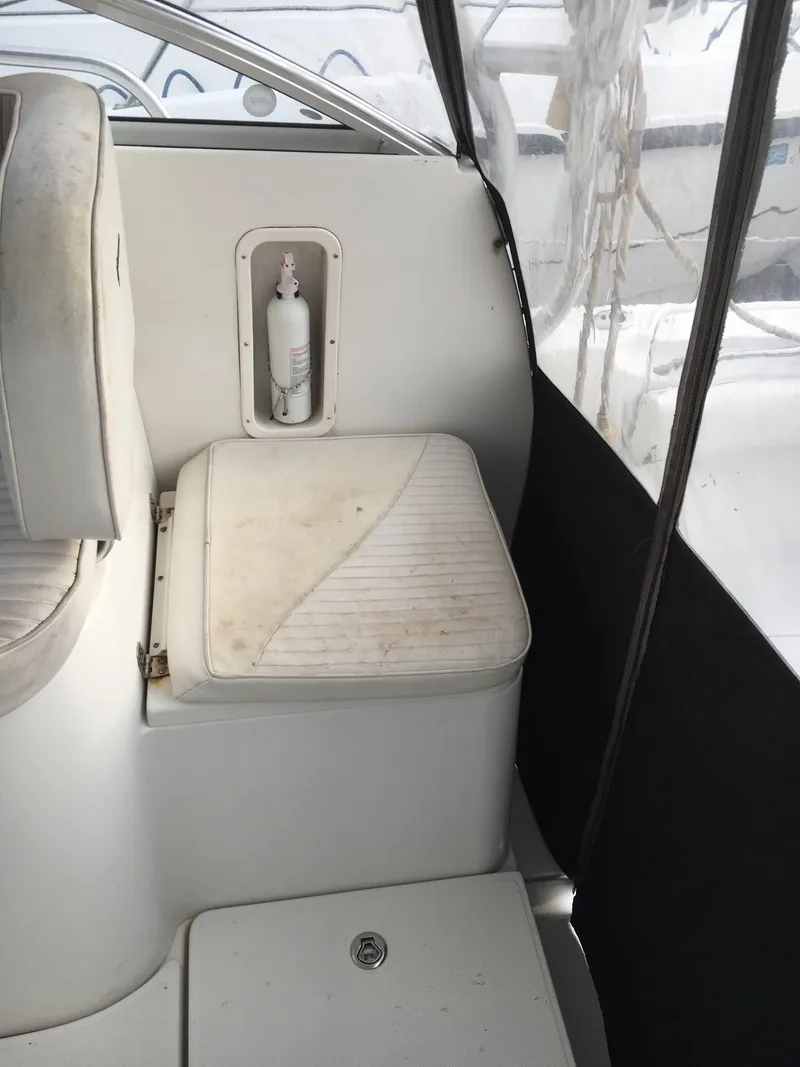 Slide: The Image of 2006 Seaswirl Striper 2901 Walkaround O/B interior seating with fire extinguisher. - 27