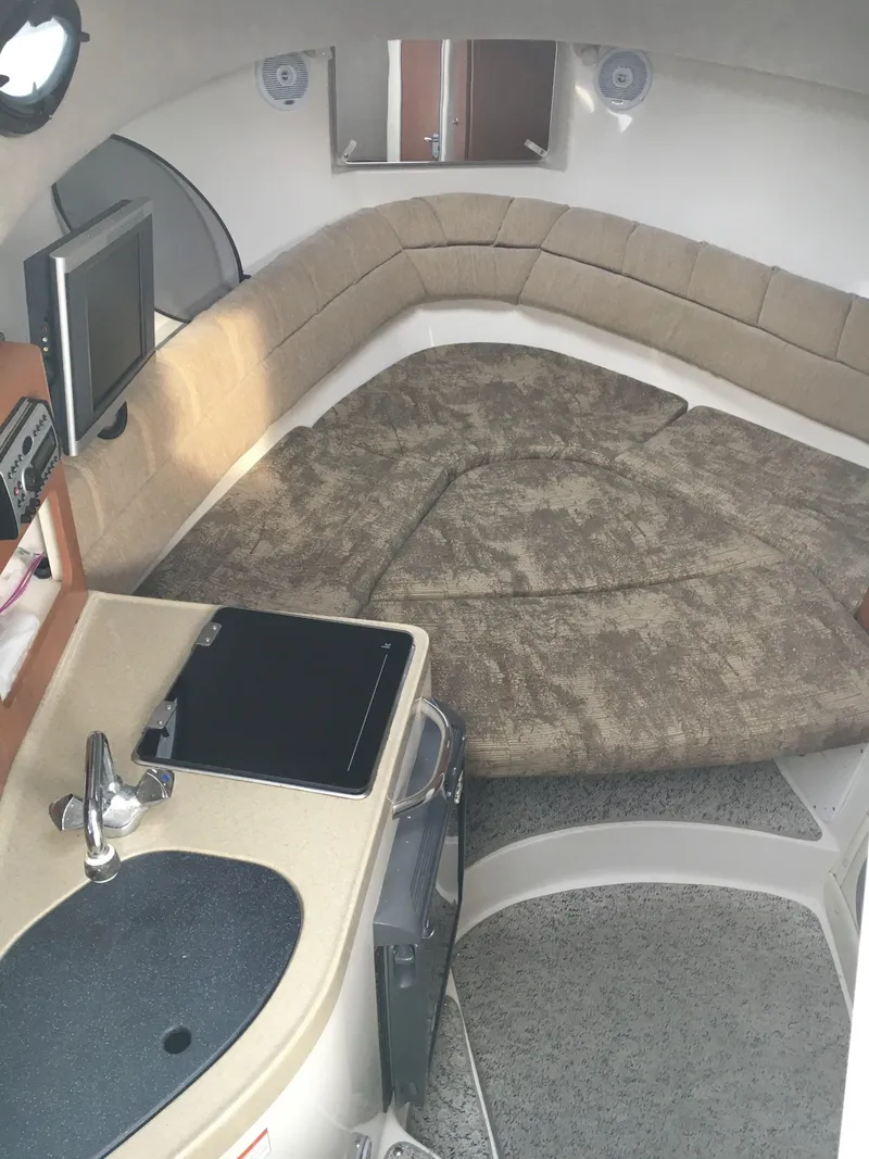 Slide: The Image of 2006 Seaswirl Striper 2901 Walkaround O/B cabin interior with kitchenette and seating area. - 28