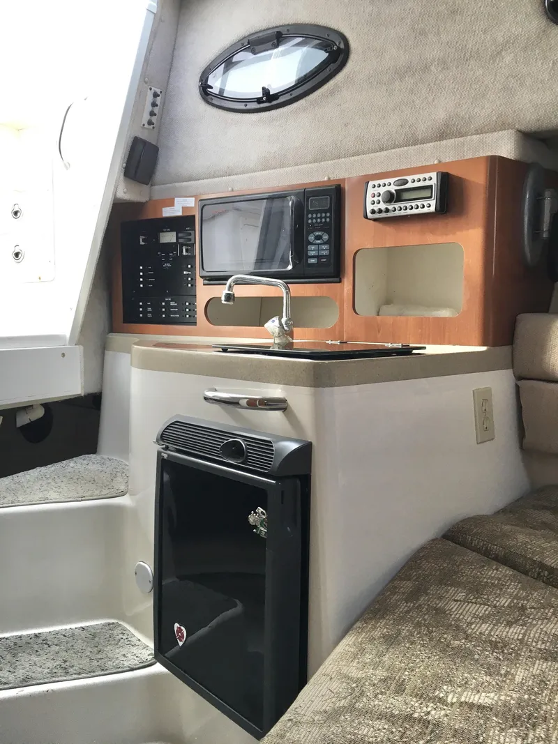 Slide: The Image of 2006 Seaswirl Striper 2901 Walkaround O/B cabin with kitchenette and modern amenities. - 30