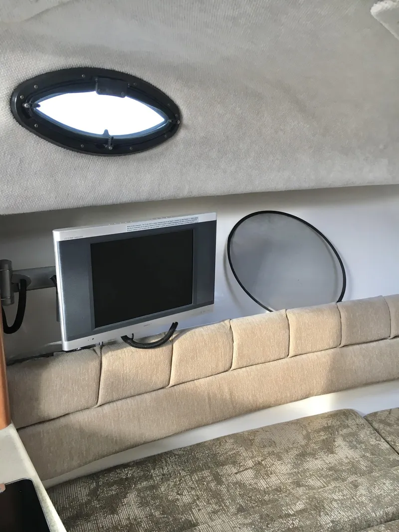 Slide: The Image of 2006 Seaswirl Striper 2901 Walkaround O/B cabin interior with TV and porthole. - 31