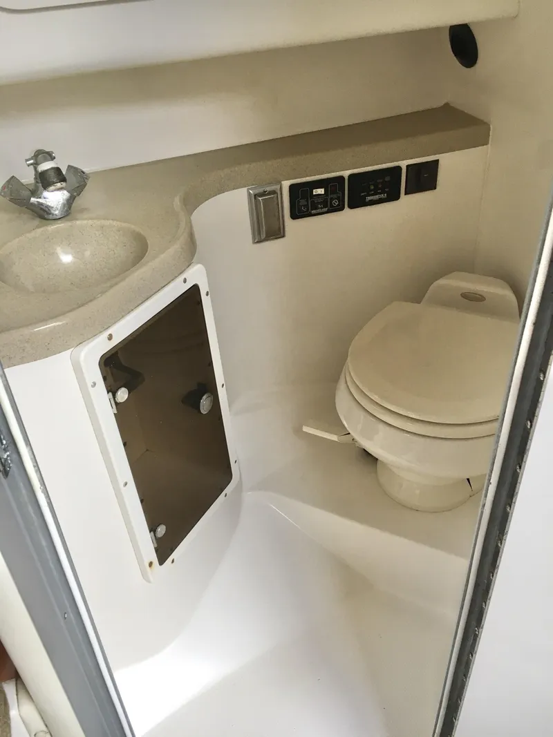Slide: The Image of 2006 Seaswirl Striper 2901 Walkaround O/B boat bathroom with sink and toilet. - 35