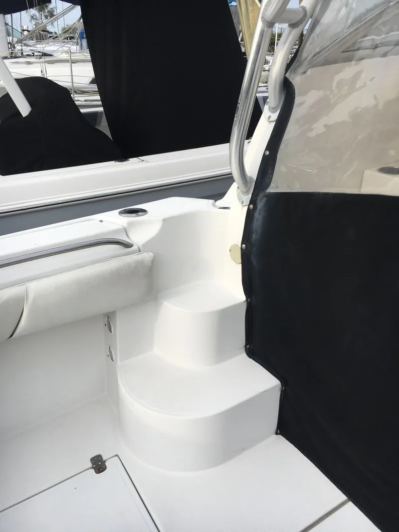 Slide: The Image of 2006 Seaswirl Striper 2901 Walkaround O/B boat interior with steps and seating area. - 7