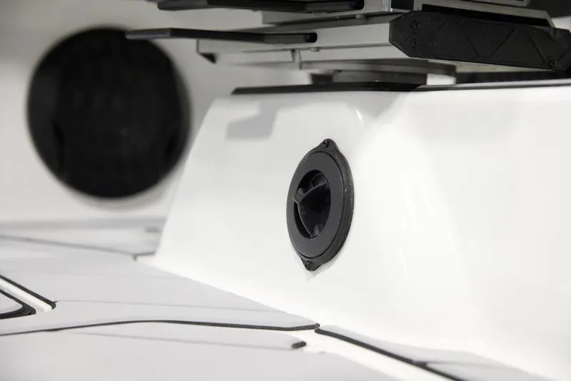 Slide: The Image of 2025 Malibu 22 LSV boat detail, featuring sleek white design and black speaker. - 12