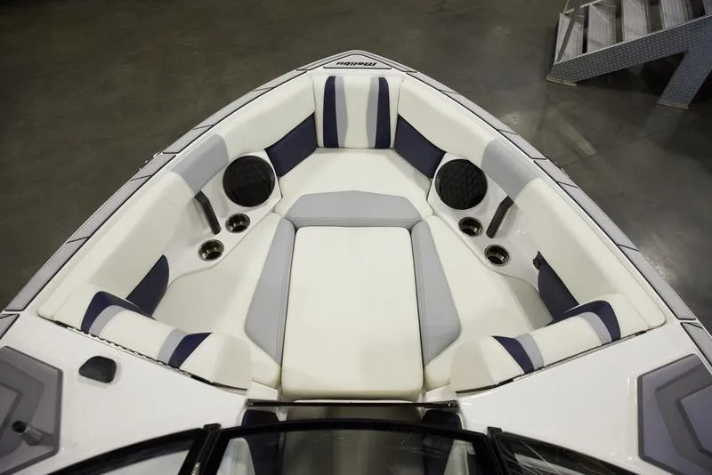 Slide: The Image of 2025 Malibu 22 LSV boat interior with cushioned seating and speakers. - 13