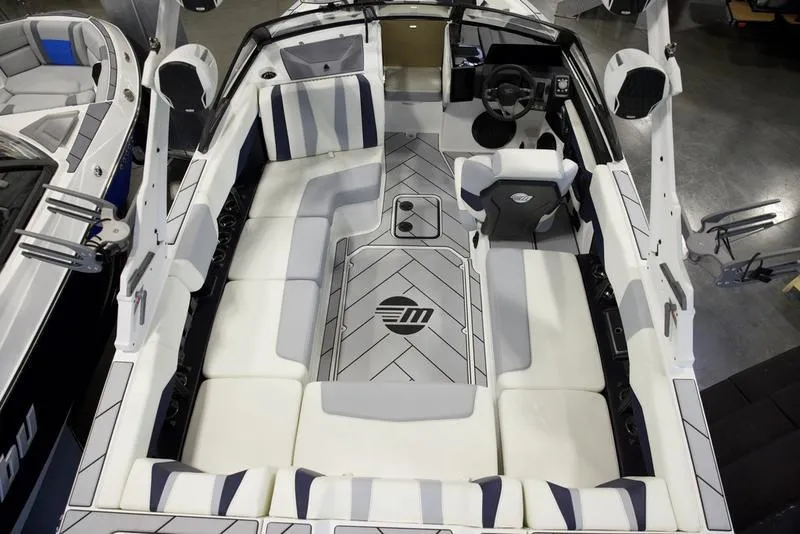 Slide: The Image of 2025 Malibu 22 LSV boat interior with sleek seating and modern design. - 7