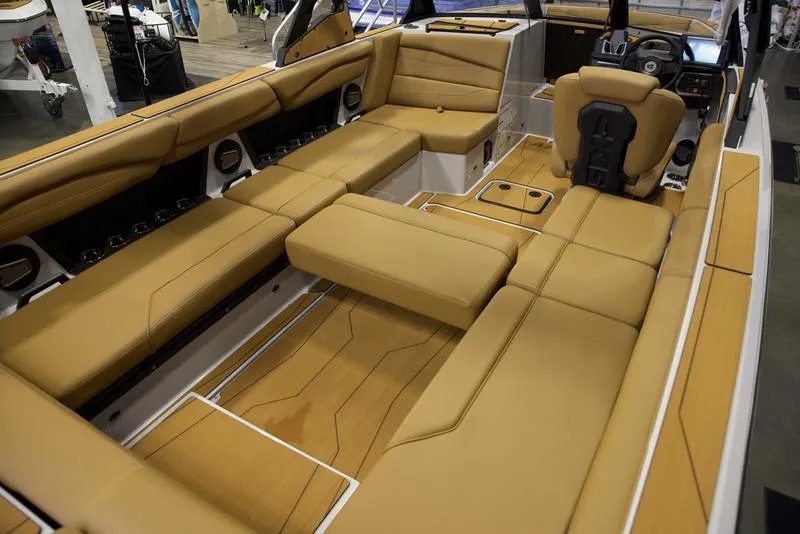 Slide: The Image of 2024 Axis A245 boat interior with tan leather seating and modern design. - 10