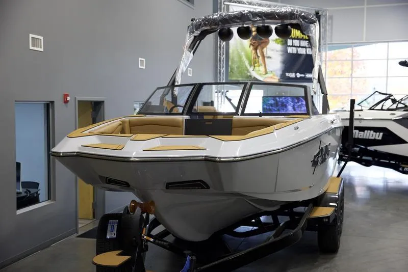 Slide: The Image of 2024 Axis A245 boat displayed in showroom, featuring sleek design and modern features. - 14
