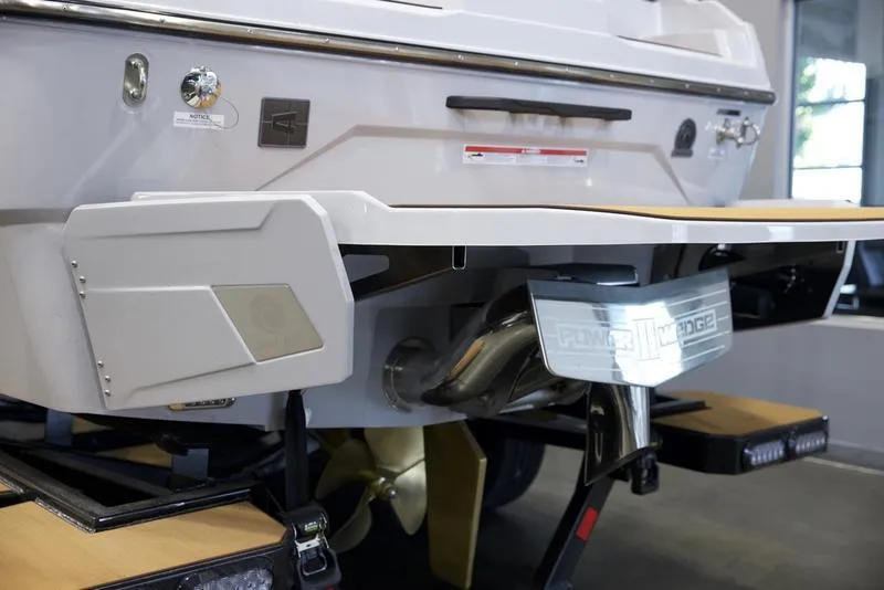 Slide: The Image of 2024 Axis A245 boat rear view, showcasing propeller and swim platform. - 15