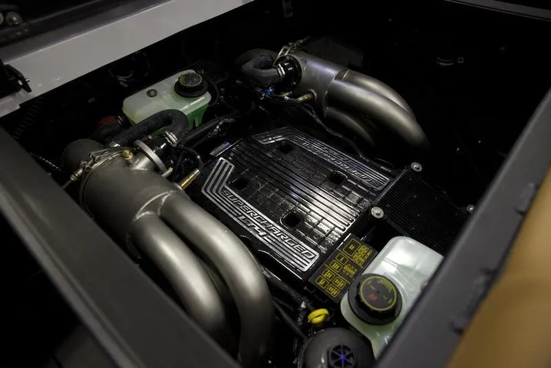 Slide: The Image of 2024 Axis A245 engine compartment with visible components and piping. - 20