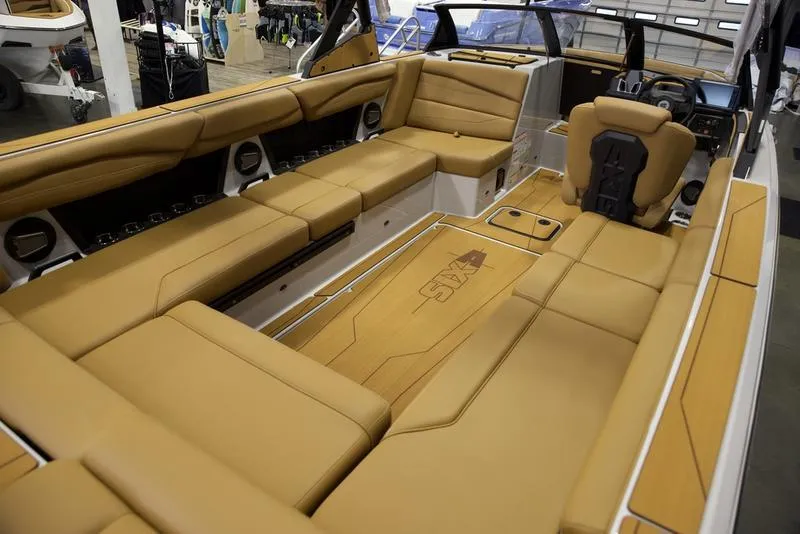 Slide: The Image of Luxurious interior of 2024 Axis A245 boat with tan leather seating. - 3