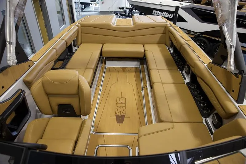 Slide: The Image of 2024 Axis A245 boat interior with tan leather seating and sleek design. - 4