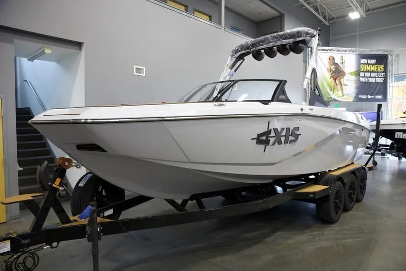 Slide: The Image of 2024 Axis A245 boat on trailer in showroom. - 6