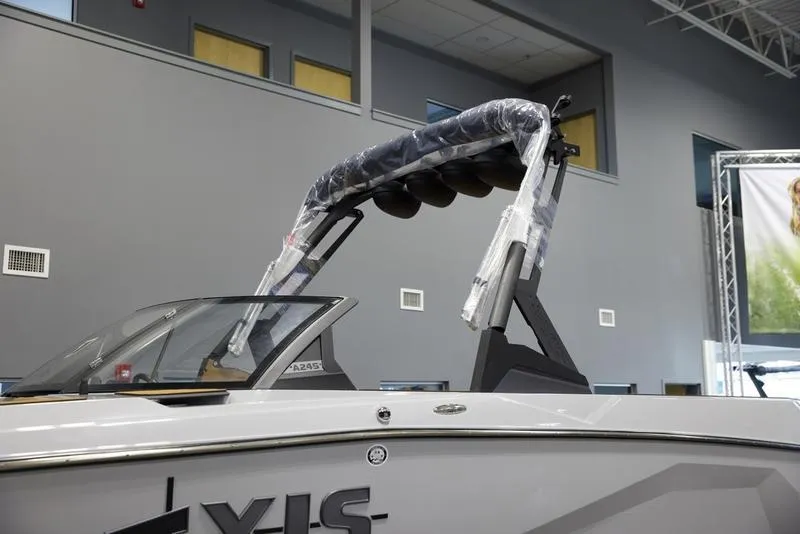 Slide: The Image of 2024 Axis A245 boat with a sleek design and covered wakeboard tower. - 7