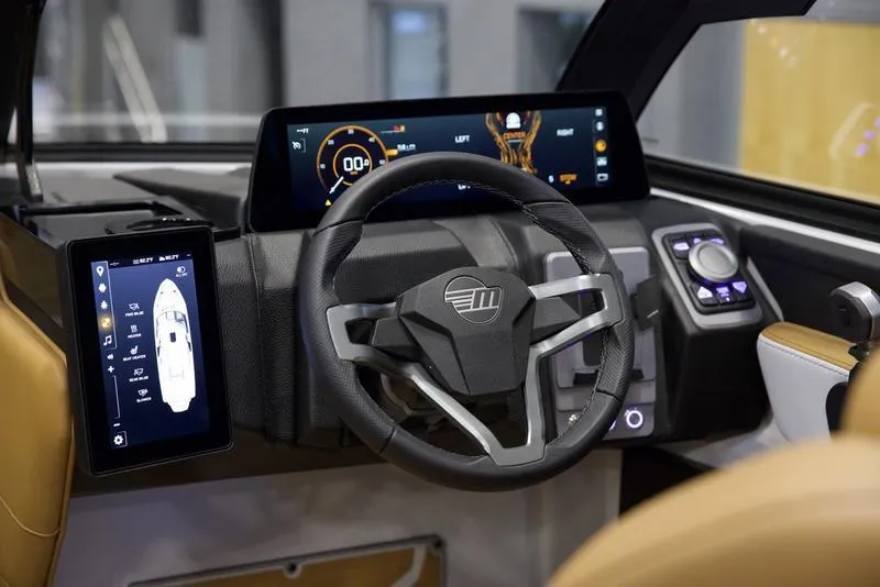 Slide: The Image of 2025 Malibu 26 LSV dashboard with advanced digital controls and sleek steering wheel design. - 15