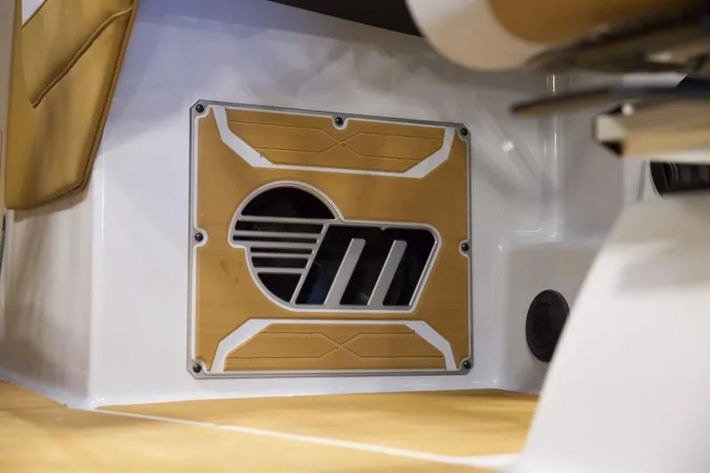 Slide: The Image of 2025 Malibu 26 LSV interior detail with stylish speaker grille design. - 16