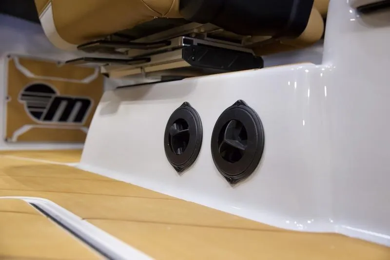 Slide: The Image of 2025 Malibu 26 LSV interior with sleek speaker system and luxurious seating. - 17