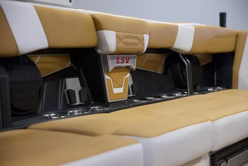 Slide: The Image of 2025 Malibu 26 LSV interior seating with tan and white upholstery. - 31