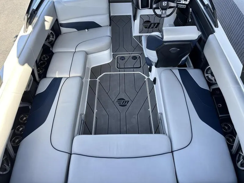Slide: The Image of 2020 Malibu 22 MXZ boat interior with sleek seating and modern design. - 10
