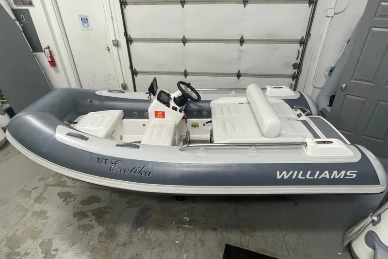 Slide: The Image of 2022 Williams Jet Tenders SportJet 345 in a garage setting. - 0