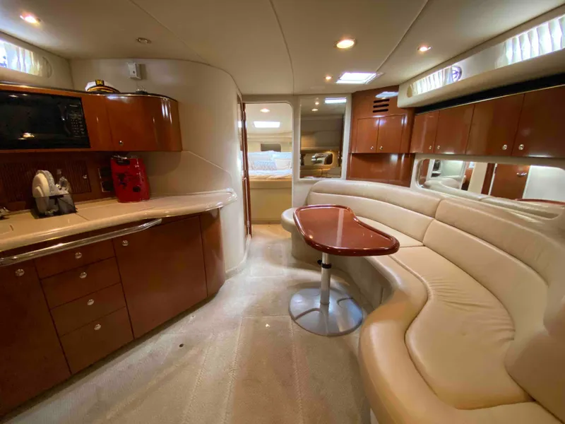 Slide: The Image of Luxurious interior of 2002 Sea Ray 380 Sundancer yacht with elegant seating and cabinetry. - 11