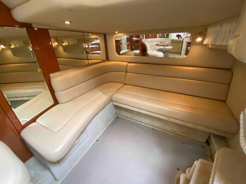 Slide: The Image of Luxurious interior of 2002 Sea Ray 380 Sundancer yacht with beige leather seating. - 14