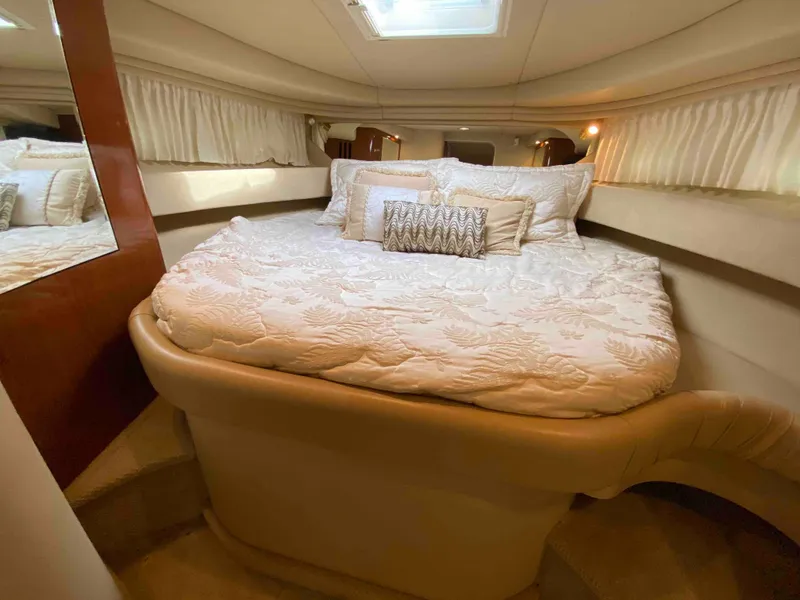 Slide: The Image of Luxurious bedroom interior of 2002 Sea Ray 380 Sundancer yacht. - 16