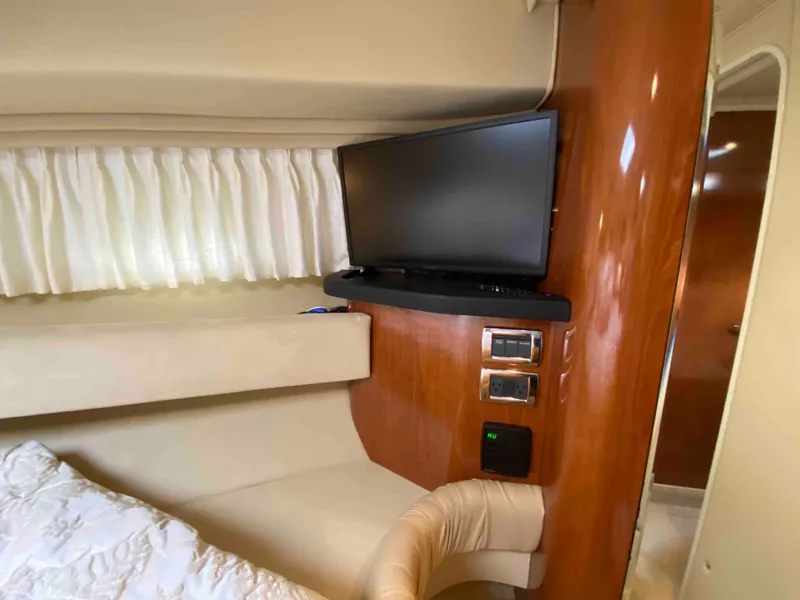 Slide: The Image of Interior of 2002 Sea Ray 380 Sundancer with TV and seating area. - 17