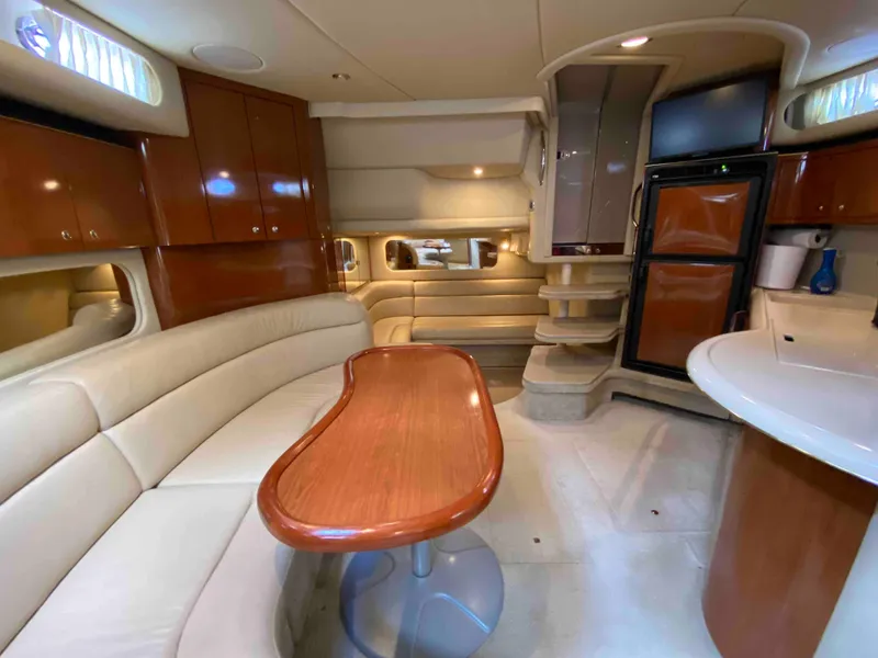 Slide: The Image of Luxurious interior of 2002 Sea Ray 380 Sundancer yacht with elegant seating and cabinetry. - 18