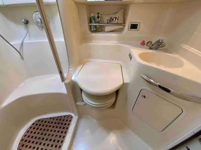 Slide: The Image of 2002 Sea Ray 380 Sundancer bathroom with shower, toilet, and sink. - 19