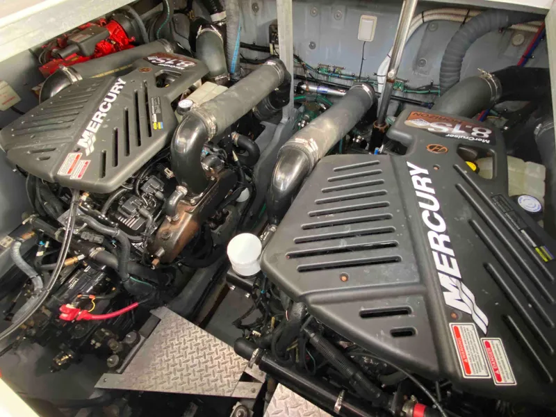 Slide: The Image of Twin Mercury engines in a 2002 Sea Ray 380 Sundancer boat engine room. - 21