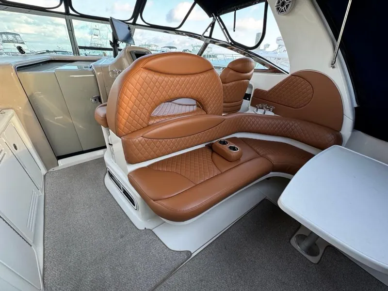 Slide: The Image of Luxurious interior of 2002 Sea Ray 380 Sundancer with tan leather seating. - 5