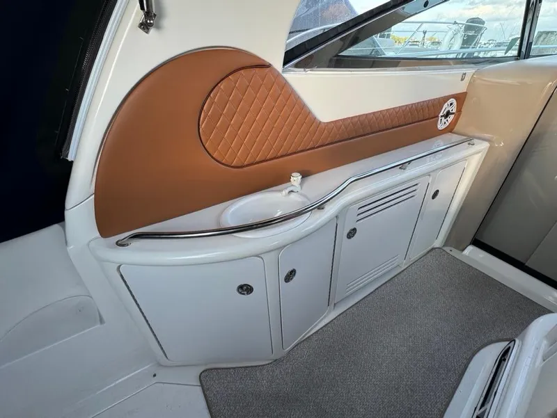 Slide: The Image of Interior of 2002 Sea Ray 380 Sundancer with elegant cabinetry and leather accents. - 9