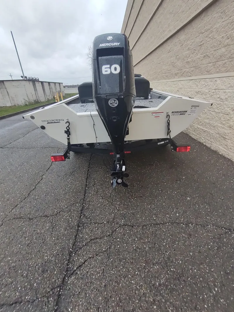 Slide: The Image of 2025 Tracker Pro Team 175 Crappie Edition boat, rear view, parked on a trailer. - 2