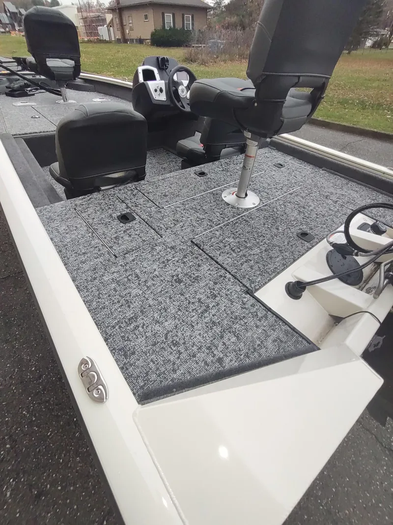 Slide: The Image of 2025 Tracker Pro Team 175 Crappie Edition boat interior with seating and controls. - 4