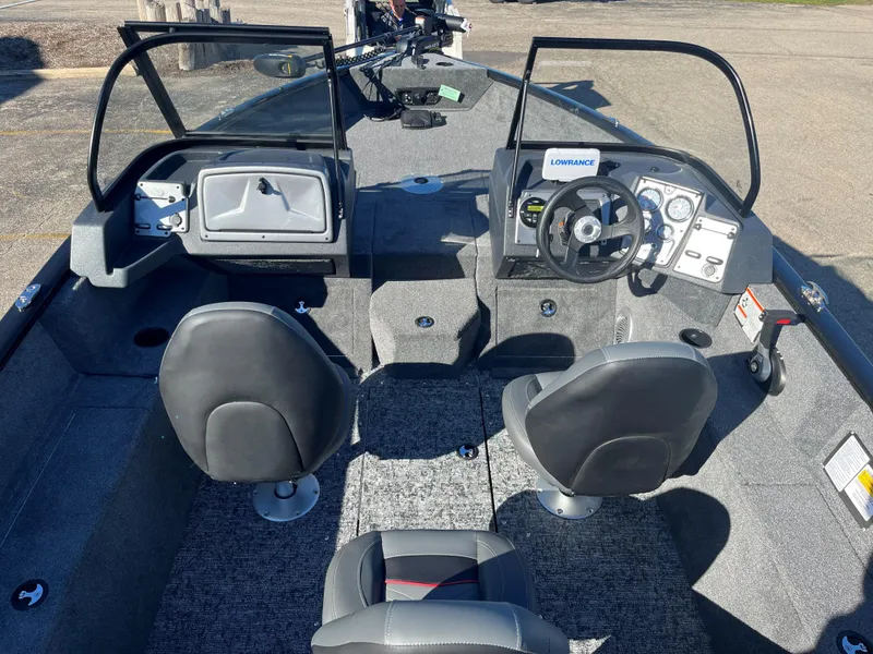 Slide: The Image of 2025 Tracker Pro Guide V-175 Combo boat interior with dual seats and steering console. - 2