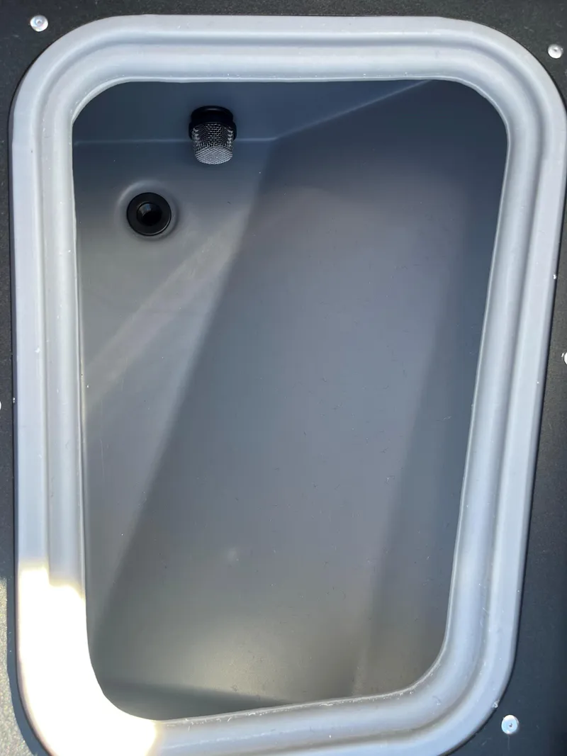 Slide: The Image of 2025 Tracker Pro Guide V-175 Combo boat storage compartment. - 6