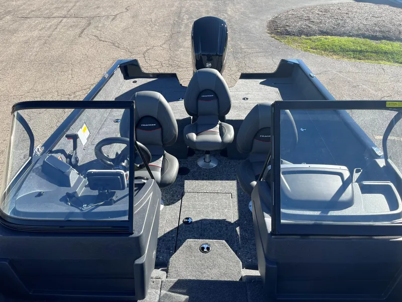 Slide: The Image of 2025 Tracker Pro Guide V-175 Combo boat interior with seating and steering console. - 7