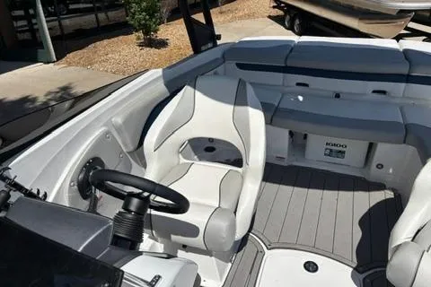Slide: The Image of 2024 Tahoe 210 Si Limited boat interior with steering wheel and seating. - 7