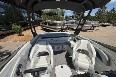 Slide: The Image of 2024 Tahoe 210 Si Limited boat interior with white seating and modern design. - 10