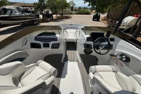 Slide: The Image of 2024 Tahoe 210 Si Limited boat interior with modern dashboard and comfortable seating. - 9