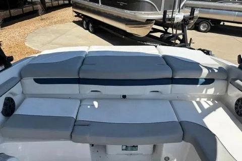Slide: The Image of 2024 Tahoe 210 Si Limited boat interior with cushioned seating and sleek design. - 13