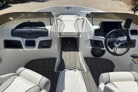 Slide: The Image of 2024 Tahoe 210 Si Limited boat interior with modern dashboard and seating. - 6