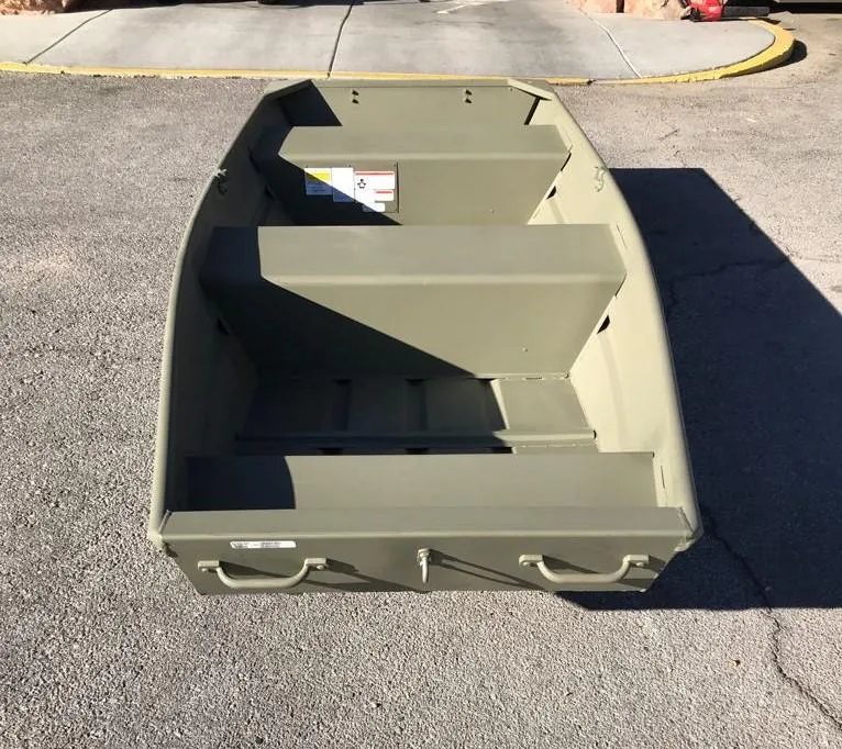 Slide: The Image of 2025 Tracker Grizzly 1236 Utility boat on pavement, showcasing interior layout. - 6