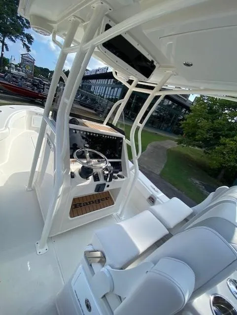 Slide: The Image of 2024 Ranger 2600 Bay boat interior with steering console and seating. - 5