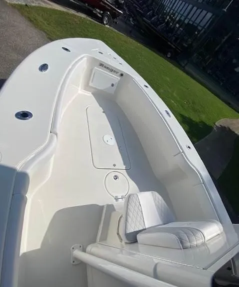 Slide: The Image of 2024 Ranger 2600 Bay boat, white interior, spacious deck, modern design. - 7