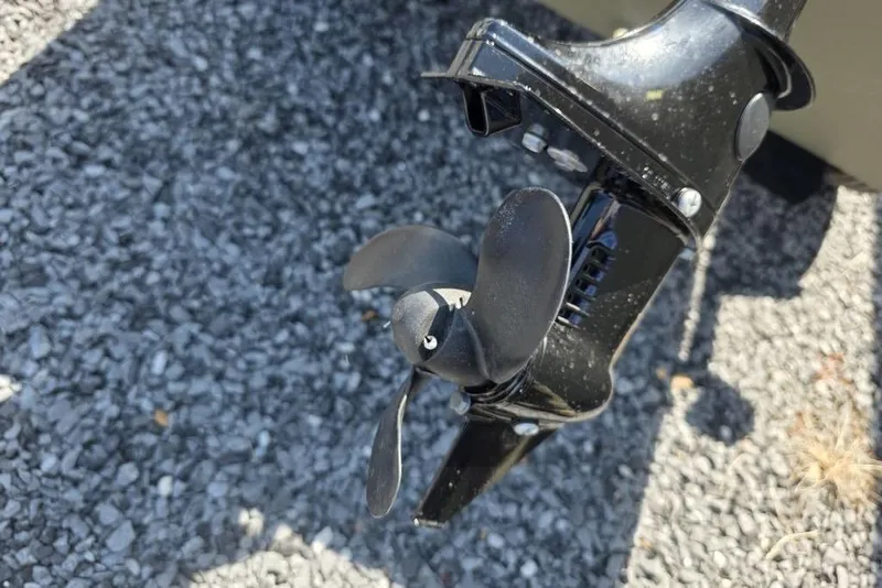 Slide: The Image of Propeller of 2025 Tracker Grizzly 10 Jon boat on gravel surface. - 7