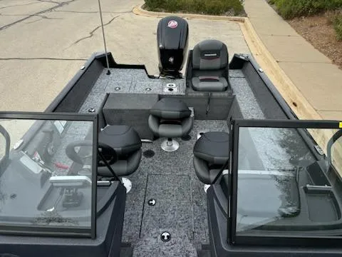 Slide: The Image of 2025 Tracker Pro Guide V-175 Combo boat interior with seating and console. - 2