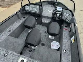 Slide: The Image of 2025 Tracker Pro Guide V-175 Combo boat interior with seating and control panel. - 3