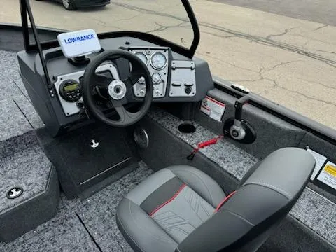 Slide: The Image of 2025 Tracker Pro Guide V-175 Combo boat interior with steering wheel and dashboard controls. - 4