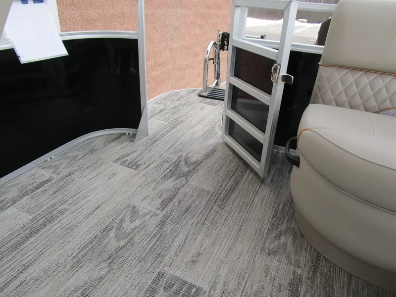 Slide: The Image of 2024 Ranger Reata 223C interior with modern flooring and comfortable seating. - 19
